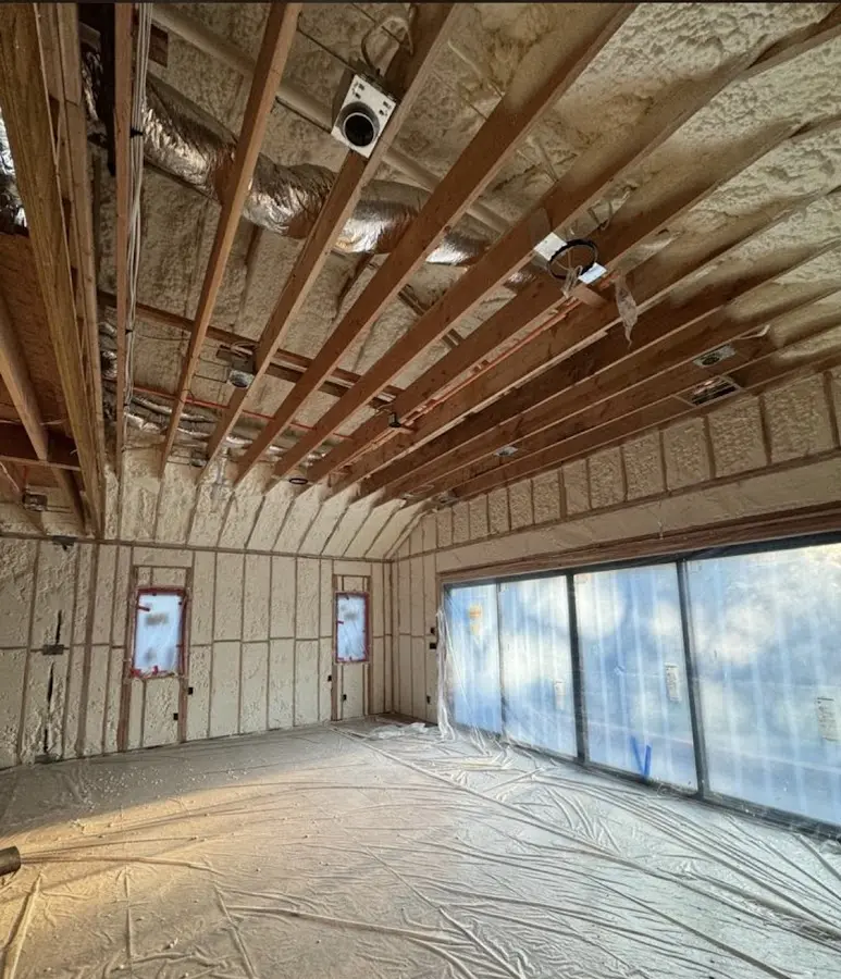 Interior walls and ceiling insulated with spray foam during new construction in Sanger